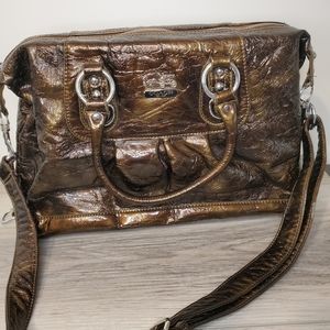 Brown coach bag with strap and handle